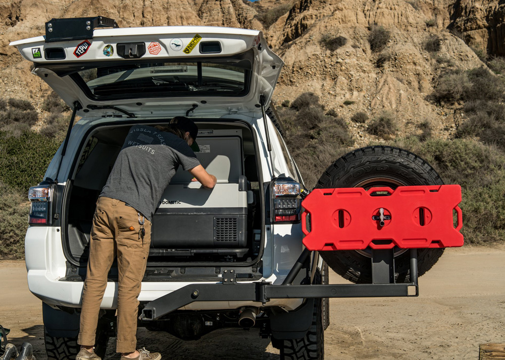 A white Toyota 4Runner with the liftgate open.